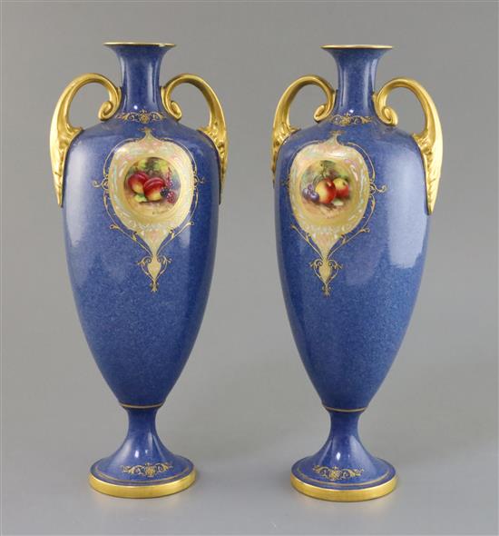 A pair of Royal Worcester two handled vases 33cm.